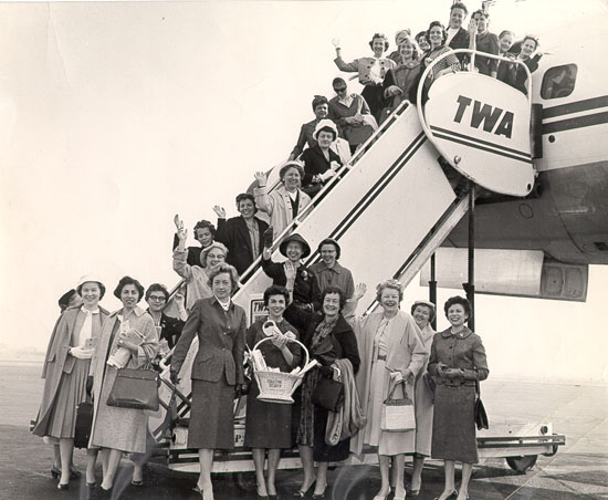 Many women on TWA airplane boarding stairs