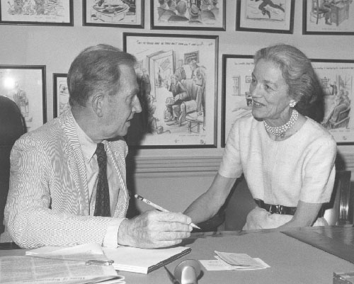 Millicent Fenwick and Clifford Case having a discussion at a office table